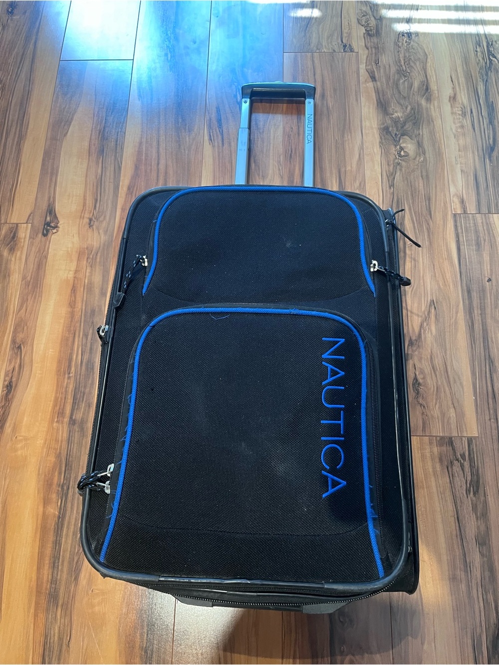 Nautica Black Suitcase with Blue Trim Rolling Carry-On